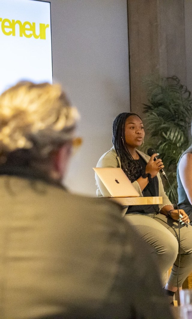 Mary Graves speaking on a business operations panel